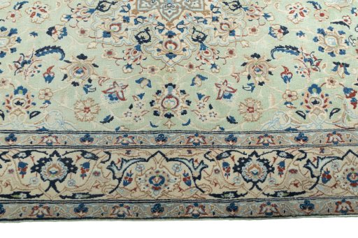 Corner detail of 2000s Nain rug showing border pattern and Wool pile