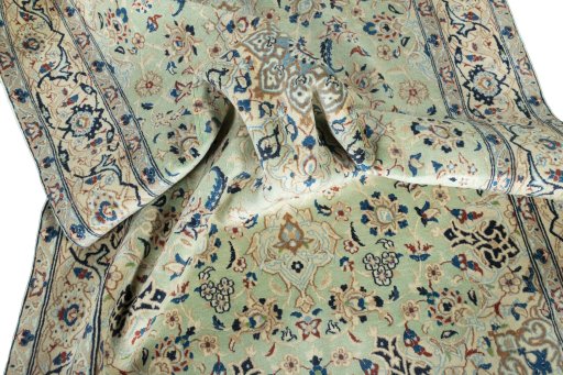 Surface texture of 2000s Nain rug with natural Wool and intricate pattern