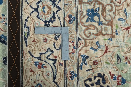 Backside of handmade 2000s Nain rug showing knot structure and weave density