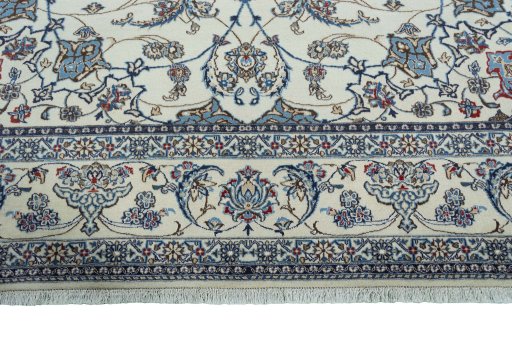Corner detail of 2000s Nain rug showing border pattern and Wool pile