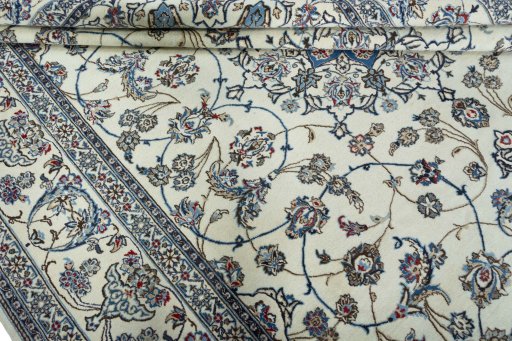 Surface texture of 2000s Nain rug with natural Wool and intricate pattern