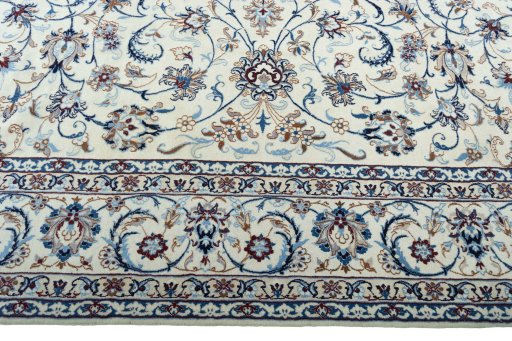 Corner detail of 2000s Nain rug showing border pattern and Wool pile