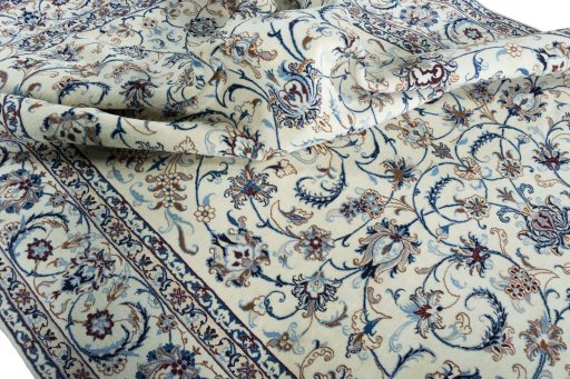 Surface texture of 2000s Nain rug with natural Wool and intricate pattern