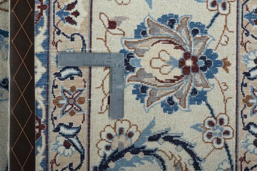 Backside of handmade 2000s Nain rug showing knot structure and weave density