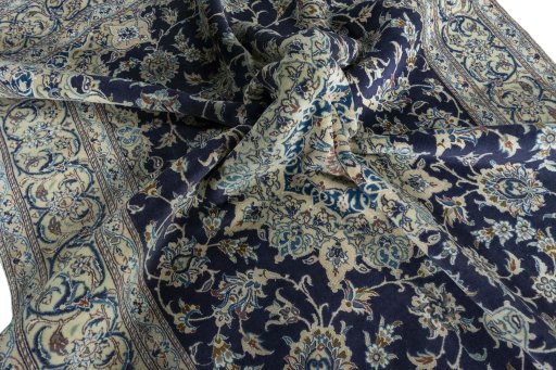 Surface texture of 2000s Nain rug with natural Wool and intricate pattern