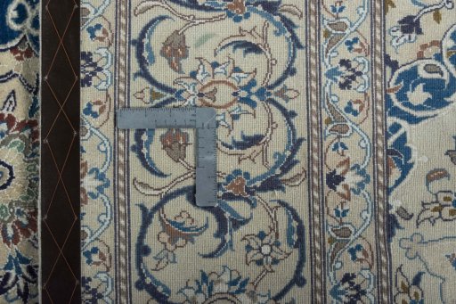 Backside of handmade 2000s Nain rug showing knot structure and weave density