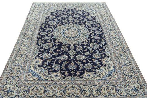 Surface texture of 2000s Nain rug with natural Wool and intricate pattern