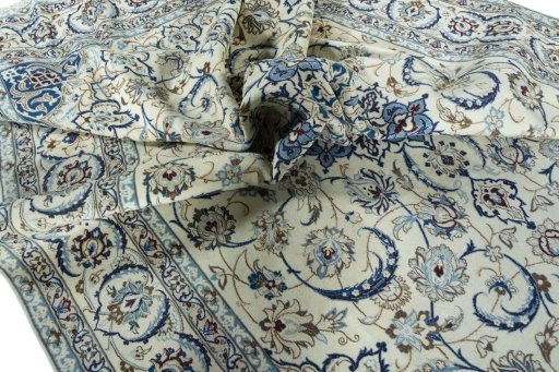 Surface texture of 2000s Nain rug with natural Wool and intricate pattern