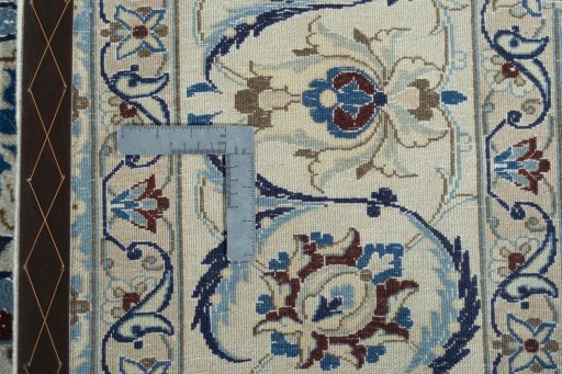 Backside of handmade 2000s Nain rug showing knot structure and weave density