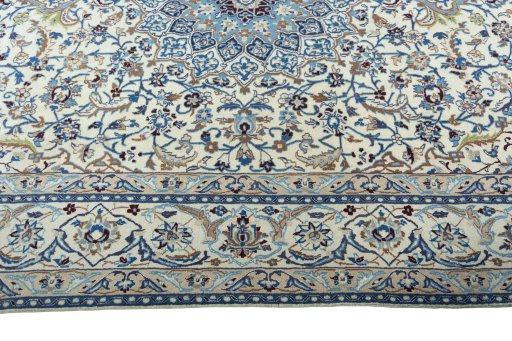 Corner detail of 2000s Nain rug showing border pattern and Wool pile