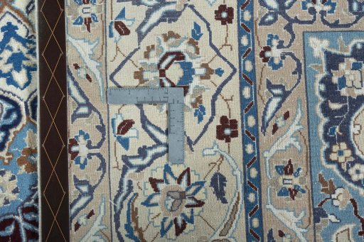 Backside of handmade 2000s Nain rug showing knot structure and weave density