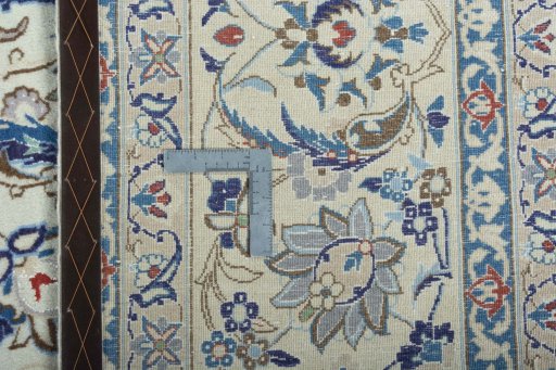 Close-up detail of 2000s Nain rug from Iran / Persia showing Wool weave