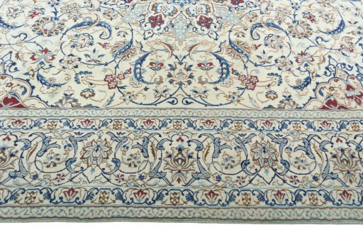 Corner detail of 2000s Nain rug showing border pattern and Wool pile