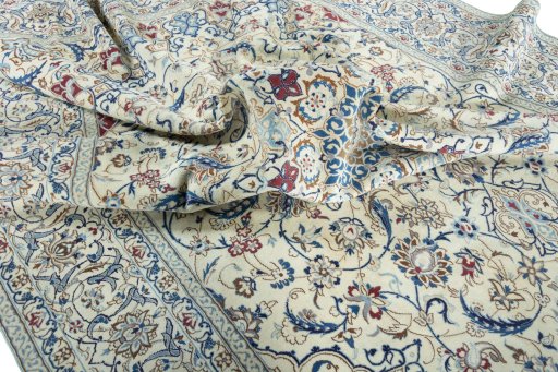 Surface texture of 2000s Nain rug with natural Wool and intricate pattern