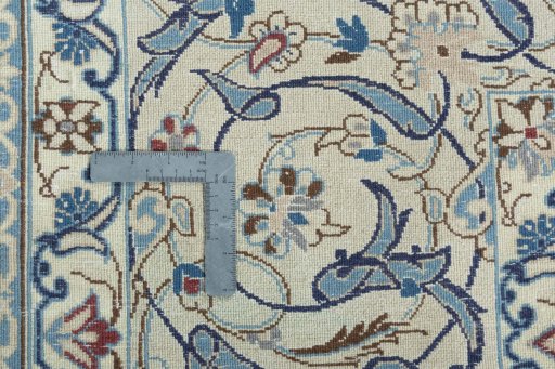 Backside of handmade 2000s Nain rug showing knot structure and weave density