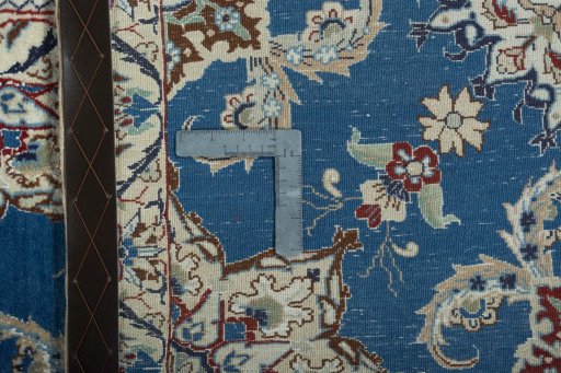 Surface texture of 2000s Nain rug with natural Wool and intricate pattern