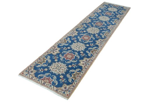 Corner detail of 2000s Nain rug showing border pattern and Wool pile