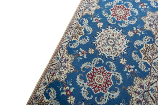 Backside of handmade 2000s Nain rug showing knot structure and weave density