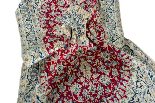 Surface texture of 2000s Nain rug with natural Wool and intricate pattern