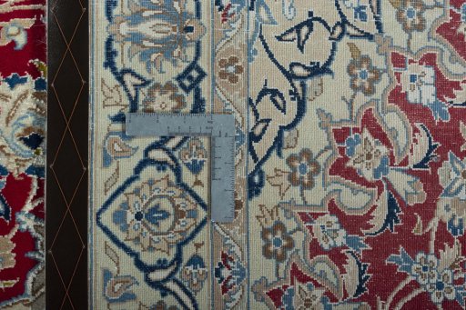 Backside of handmade 2000s Nain rug showing knot structure and weave density