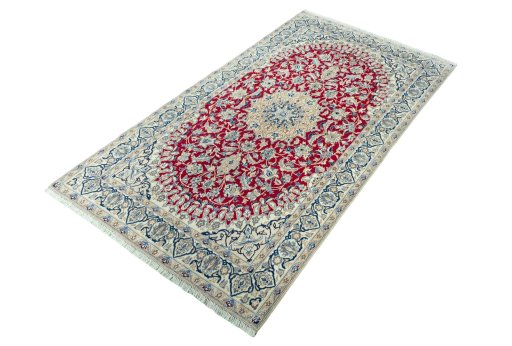 Corner detail of 2000s Nain rug showing border pattern and Wool pile