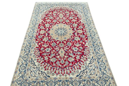 Surface texture of 2000s Nain rug with natural Wool and intricate pattern