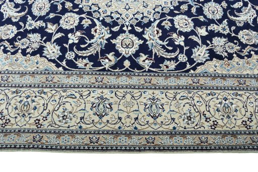 Corner detail of 2000s Nain rug showing border pattern and Wool pile