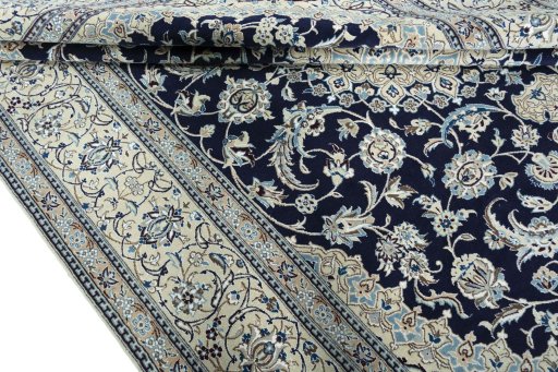 Close-up detail of 2000s Nain rug from Iran / Persia showing Wool weave