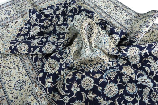 Surface texture of 2000s Nain rug with natural Wool and intricate pattern