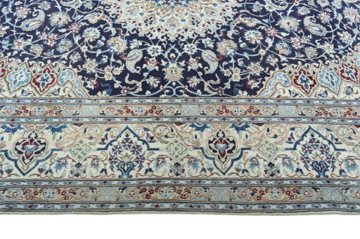 Corner detail of 2000s Nain rug showing border pattern and Wool pile