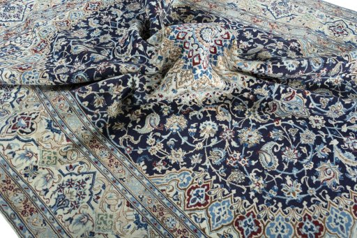 Surface texture of 2000s Nain rug with natural Wool and intricate pattern