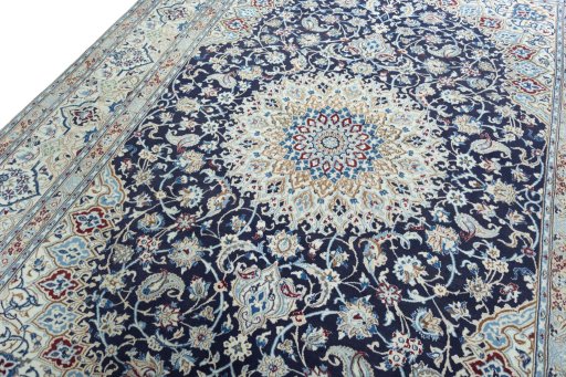 Backside of handmade 2000s Nain rug showing knot structure and weave density