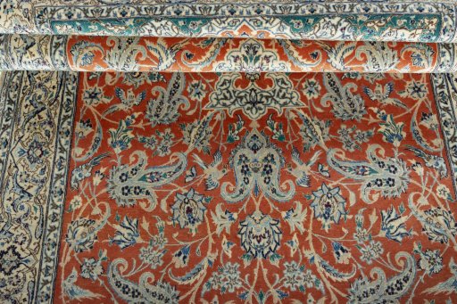 Surface texture of 1970s Nain rug with natural Cork and intricate pattern