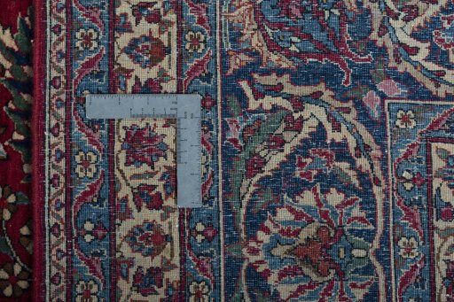 Backside of handmade 1930s Nain rug showing knot structure and weave density