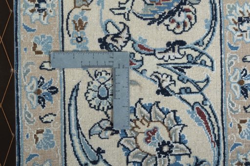 Backside of handmade 2000s Nain rug showing knot structure and weave density