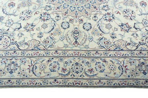Corner detail of 2000s Nain rug showing border pattern and Wool pile