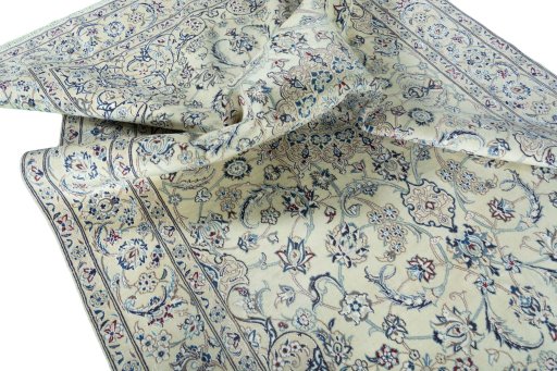 Surface texture of 2000s Nain rug with natural Wool and intricate pattern