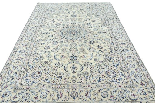 Surface texture of 2000s Nain rug with natural Wool and intricate pattern