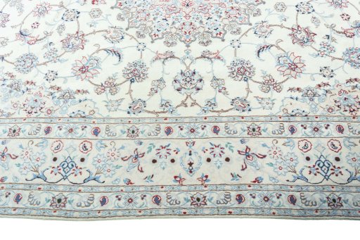 Corner detail of 2000s Nain rug showing border pattern and Wool pile