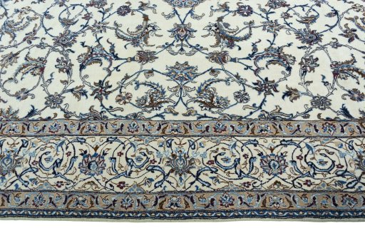 Corner detail of 2000s Nain rug showing border pattern and Wool pile