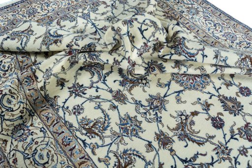 Surface texture of 2000s Nain rug with natural Wool and intricate pattern