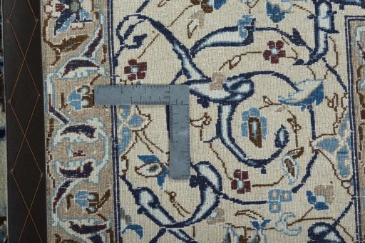 Backside of handmade 2000s Nain rug showing knot structure and weave density