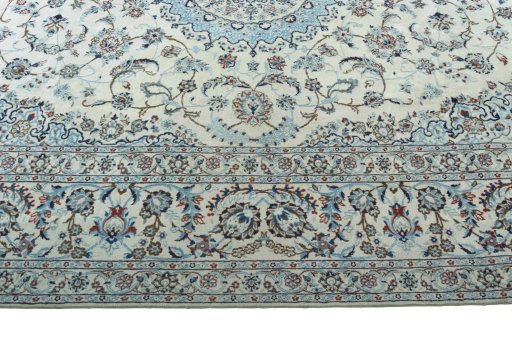 Corner detail of 2000s Nain rug showing border pattern and Wool pile
