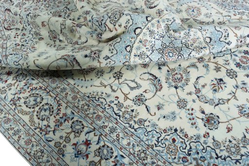 Surface texture of 2000s Nain rug with natural Wool and intricate pattern