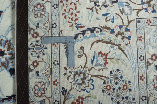 Backside of handmade 2000s Nain rug showing knot structure and weave density