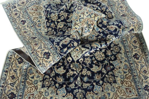 Surface texture of 2000s Nain rug with natural Wool and intricate pattern