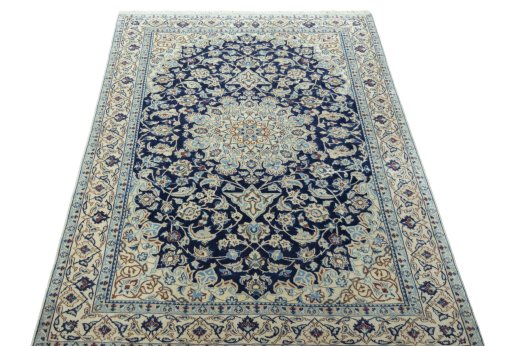 Surface texture of 2000s Nain rug with natural Wool and intricate pattern