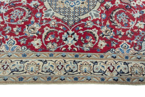 Corner detail of 2000s Nain rug showing border pattern and Wool pile
