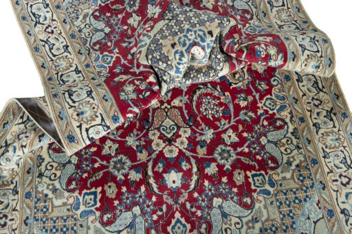 Surface texture of 2000s Nain rug with natural Wool and intricate pattern