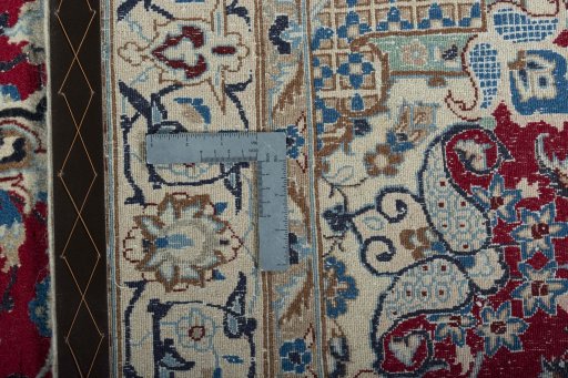 Backside of handmade 2000s Nain rug showing knot structure and weave density